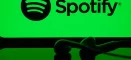 Logo Spotify so slúchadlami v popredí